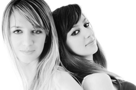 two young girl lesbian friend isolated happy on white backgroundの写真素材