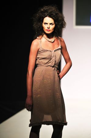 young beautiful model walking on fashion show pisteの写真素材
