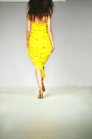 young beautiful model walking on fashion show pisteの写真素材