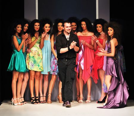 young successful fashion designer on the end of fashion show young successful fashion designer on the end of fashion show