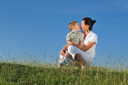 happy young woman mother play and outdoor with beautiful childの写真素材