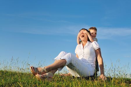 happy young woman mother play and outdoor with beautiful childの写真素材