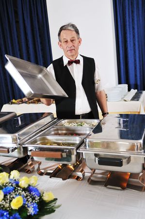 catering buffet food party preparation manの写真素材