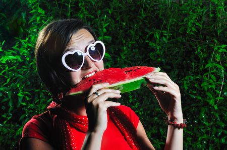 funny fashion happy woman with heart shape heart and watermelon の写真素材