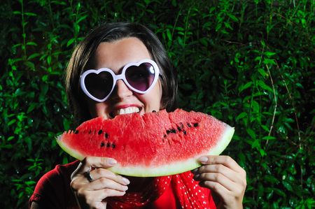 funny fashion happy woman with heart shape heart and watermelon の写真素材
