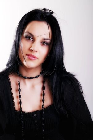 one brunette woman posing in studio の写真素材