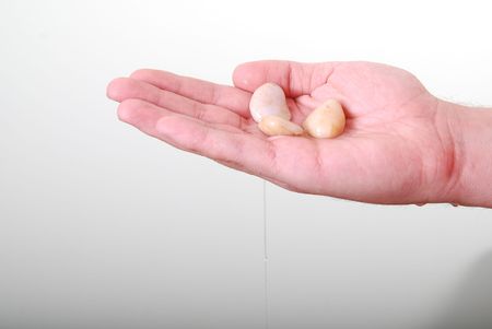 hot stones in hand isolatedの写真素材