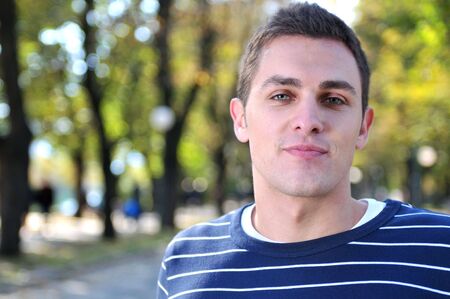 happy young casual man outdoor portrait posingの写真素材