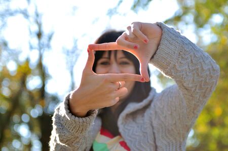 brunette Cute young woman  posing outdoors in natureの写真素材