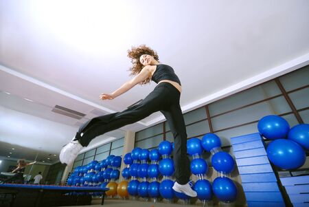 Dancing woman, happy and jumping up.の写真素材