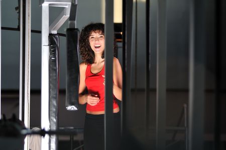 young woman practicing fitness and working out in a gym