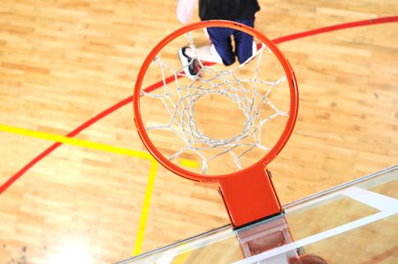 one healthy young  man play basketball game in school gym indoor
