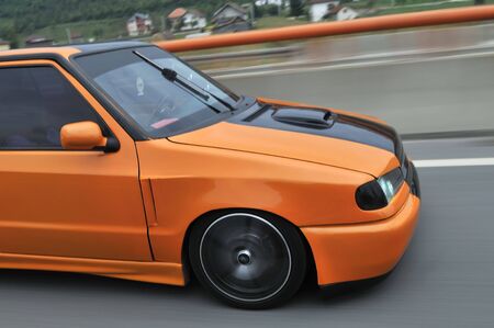 Picutre of  tuning cars speeding on highway captured with long exposure の写真素材