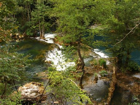 fresh water of clean wild river with waterfall in natureの写真素材