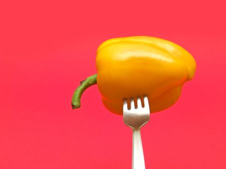 red pepper on red backgroundの写真素材