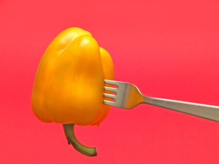 red pepper on red background