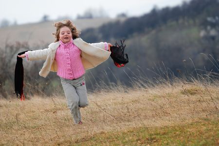 beautiful running girl on meadow の写真素材