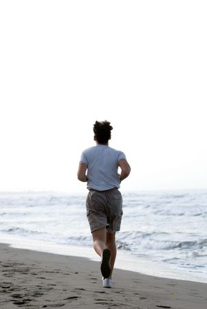 man running on beachの写真素材