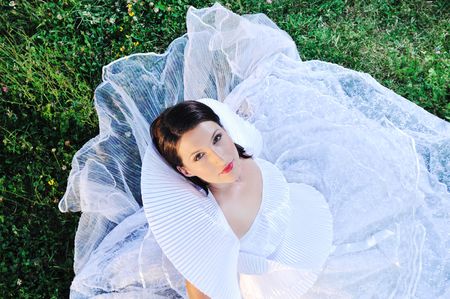 happy young beautiful bride after wedding ceremony event have fun on meadow in fashionable wedding dressの写真素材