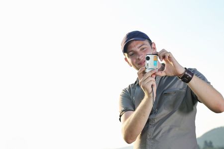 amateur photographer with point and shoot photo camere outdoor in natureの写真素材