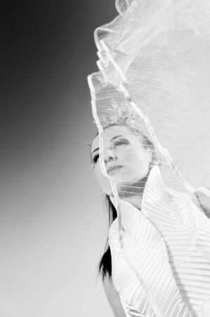 happy young beautiful bride after wedding ceremony event have fun on meadow in fashionable wedding dressの写真素材