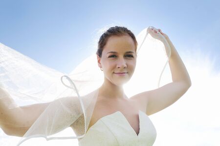 happy young beautiful bride after wedding ceremony event have fun outdoor on meadow at sunset