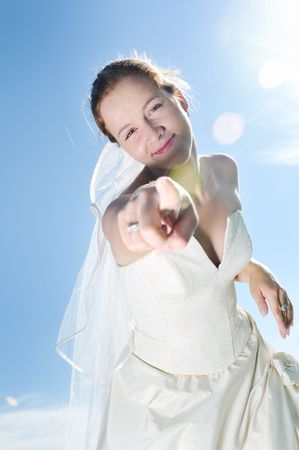 happy young beautiful bride after wedding ceremony event have fun outdoor on meadow at sunsetの写真素材