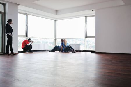 profesional stock photographer on stock photo session with young models 