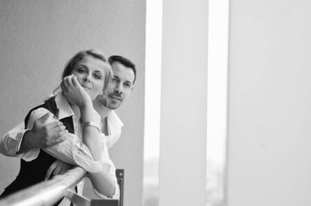 romantic happy couple relax and have fun at balcony in their new home apartmentの写真素材