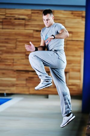 one young healthy man exercice fitness recreation and yoga indoor