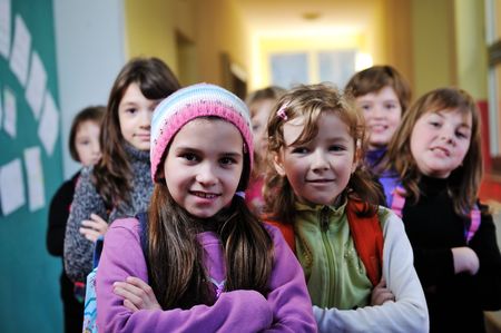 happy childrens group in schoold have fun and learning leassos