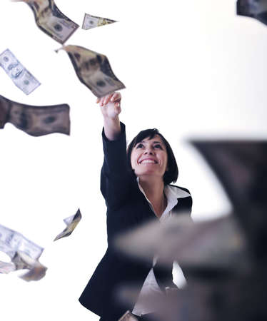 happy young business woman isolated on white playing with dollars money and representing success in financeの写真素材