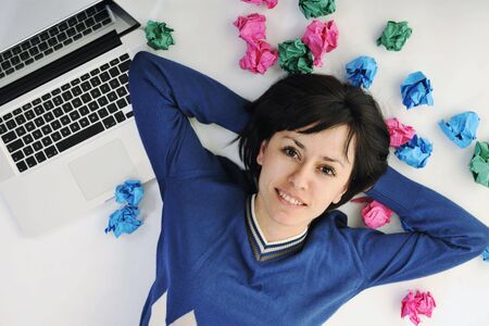 young beautiful brunette student woman working on laptop computer and finding solutionsの写真素材
