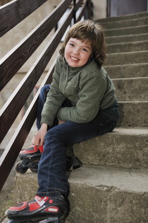 happy young girl relax and skates outdoorの写真素材