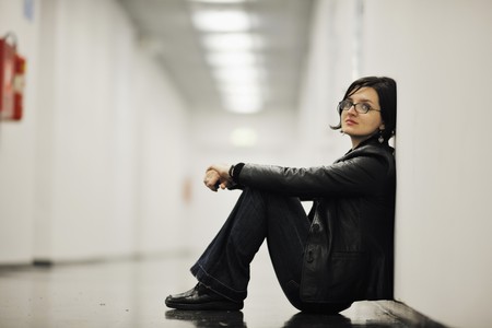 young casual woman relax indoor in big bright holdの写真素材