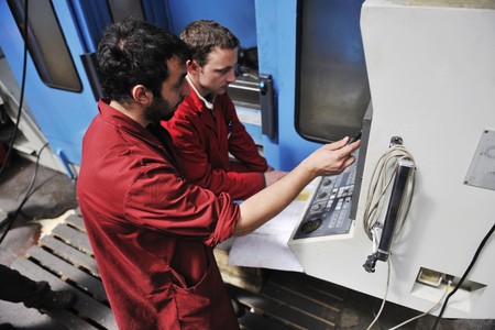 engineering people manofacturing industry with big modern computer mashines