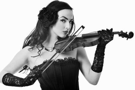 beautiful young happy woman play violin music instrument isolated on whiteの写真素材