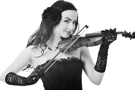 beautiful young happy woman play violin music instrument isolated on whiteの写真素材