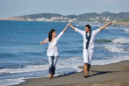 happy young couple in white clothing  have romantic recreation and   fun at beautiful beach on  vacationsの写真素材