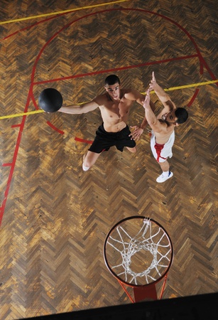 young and healthy people man have recreation and training exercise  while play basketball game at sport gym indoor hallの写真素材