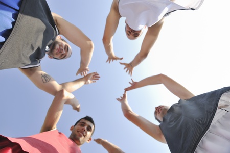 basketball player team group  posing on streetbal court at the city on early morningの写真素材
