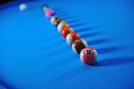 billiard sport game balls on blue table on billiard club ready to playの写真素材