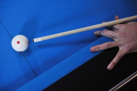 young pro billiard player finding best solution and right angle at billard or snooker pool sport ...