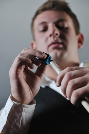 young pro billiard player finding best solution and right angle at billard or snooker pool sport ...