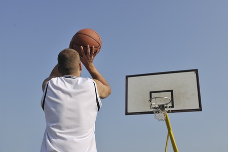 basketball player practicing and posing for basketball and sports athlete concept