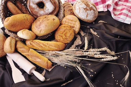 fresh healthy natural  bread food group and wheat plant in studio on tableの写真素材