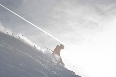 young athlete man have fun during skiing sport on hi mountain slopes at winter seasson and sunny dayの写真素材