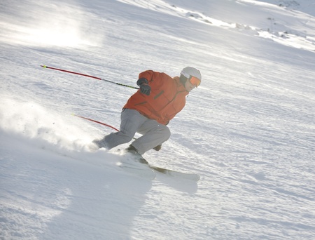 young athlete man have fun during skiing sport on hi mountain slopes at winter seasson and sunny dayの写真素材