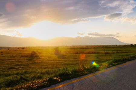 beautiful sunset in nature landscape with scenic colorsの写真素材