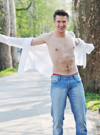 happy young romantic couple in love dance outdoor at spring season on early mornig with beautiful lightの写真素材